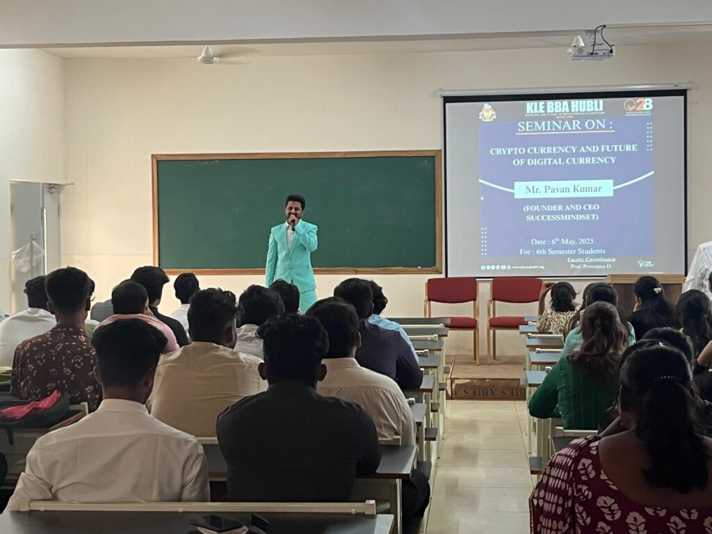 Students attending a seminar on stock market charts and investment strategies